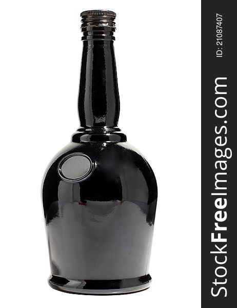 Color photo of a black glass bottle with a white background. Color photo of a black glass bottle with a white background