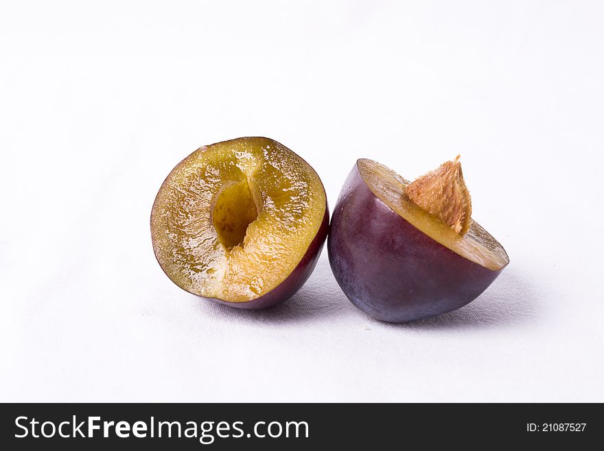 Purple plums on white background beautiful healthy. Purple plums on white background beautiful healthy