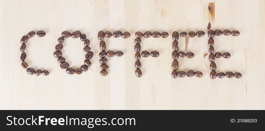 Picture of a the word COFFEE made of coffee beans