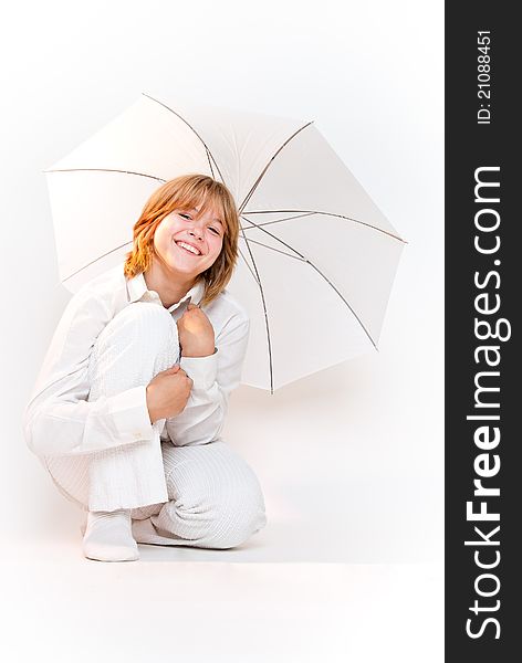 Girl Sitting With Umbrella And Smiling