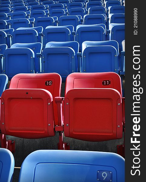 Empty red and blue stadium seating