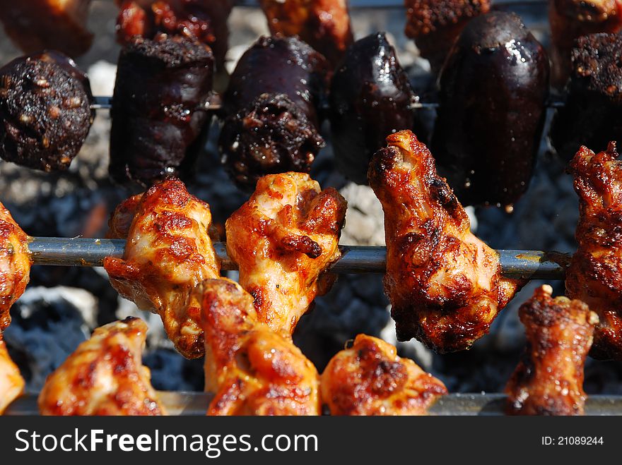 Chicken, Blood Sausage on Barbecue Grill