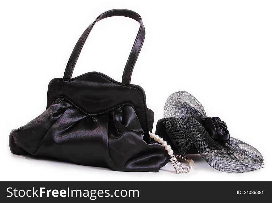 Black purse and hat and pearls