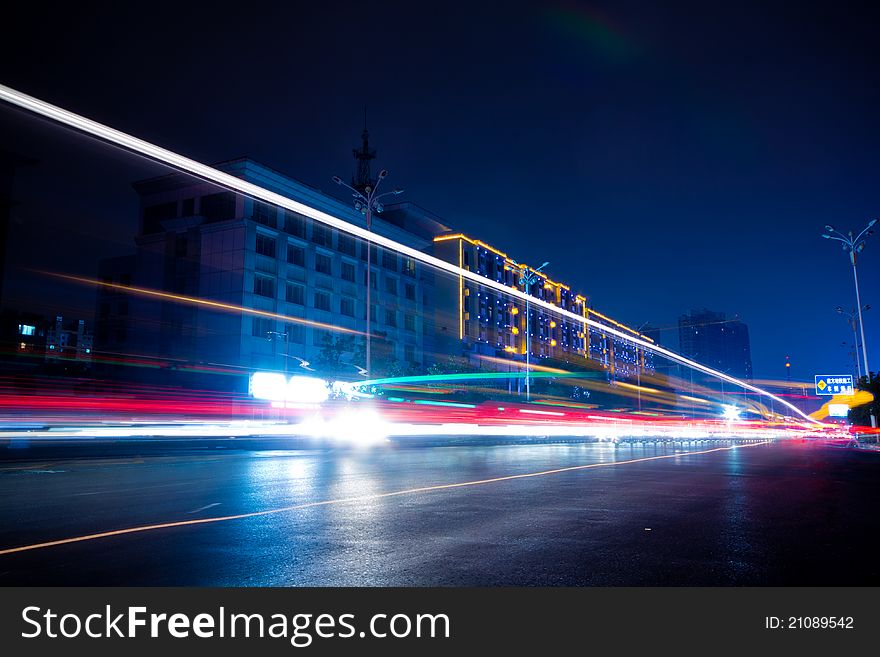 The light trails on the modern building background in shanghai china.