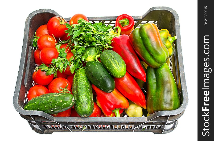 Fresh vegetables in a box on a white background