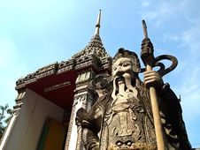 Stone Guard At Wat Pho With Blue Sky Royalty Free Stock Photo