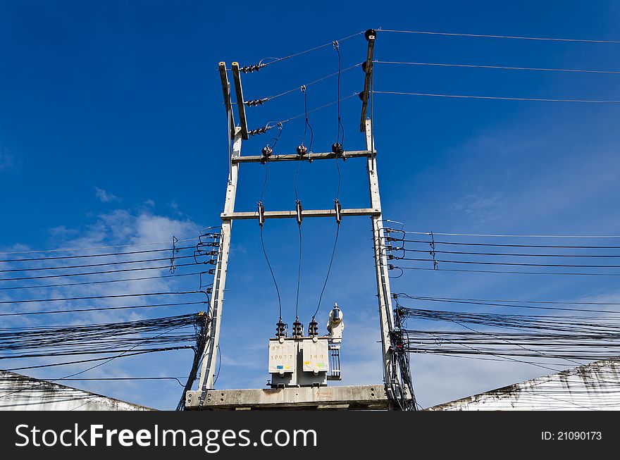 Electricity post with blue sky in the city