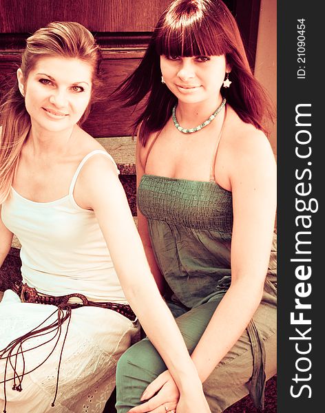 Retro Style Portrait Of Two Girls