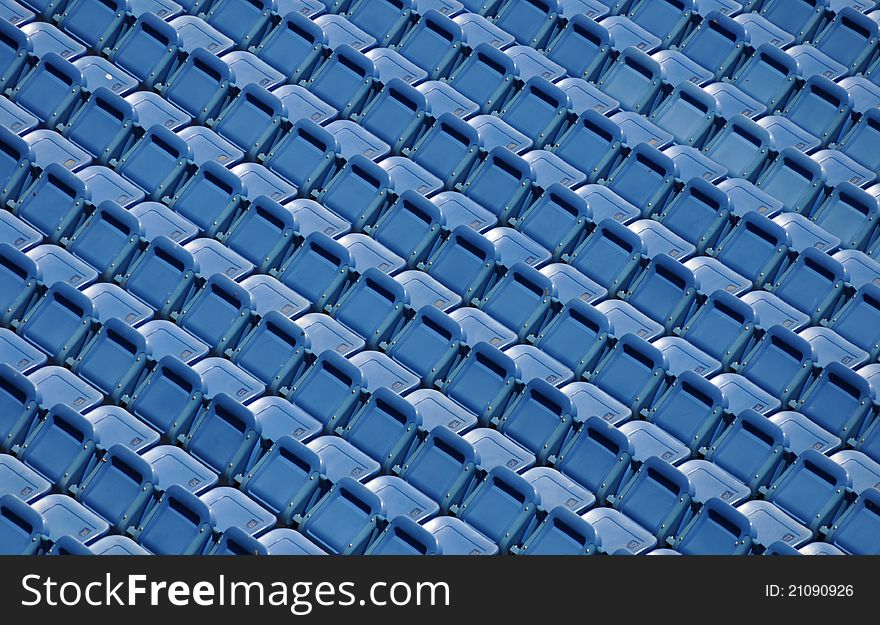 Rows of empty blue stadium seating