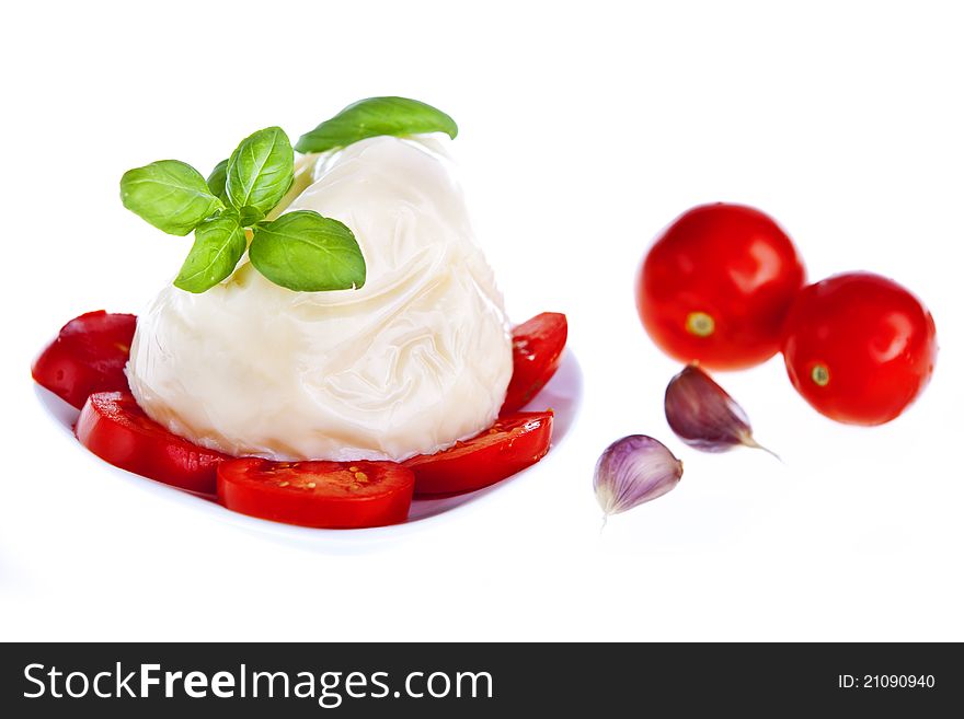 Fresh garden tomatoes with mozzarella and basil. Fresh garden tomatoes with mozzarella and basil.