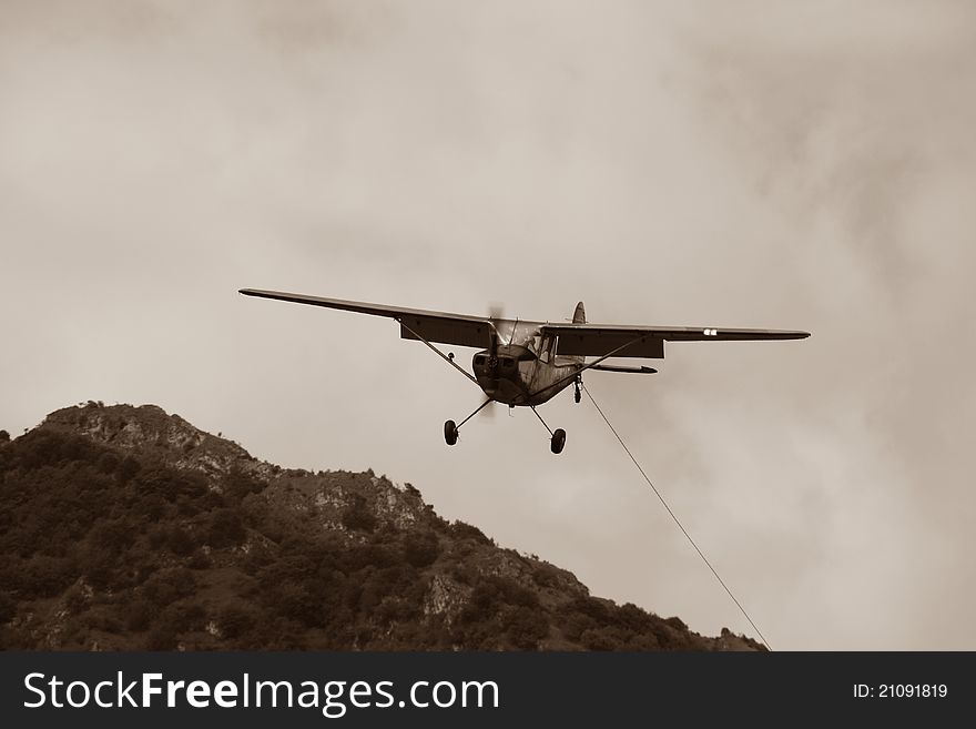 Old Airplane on Landing with mountains back