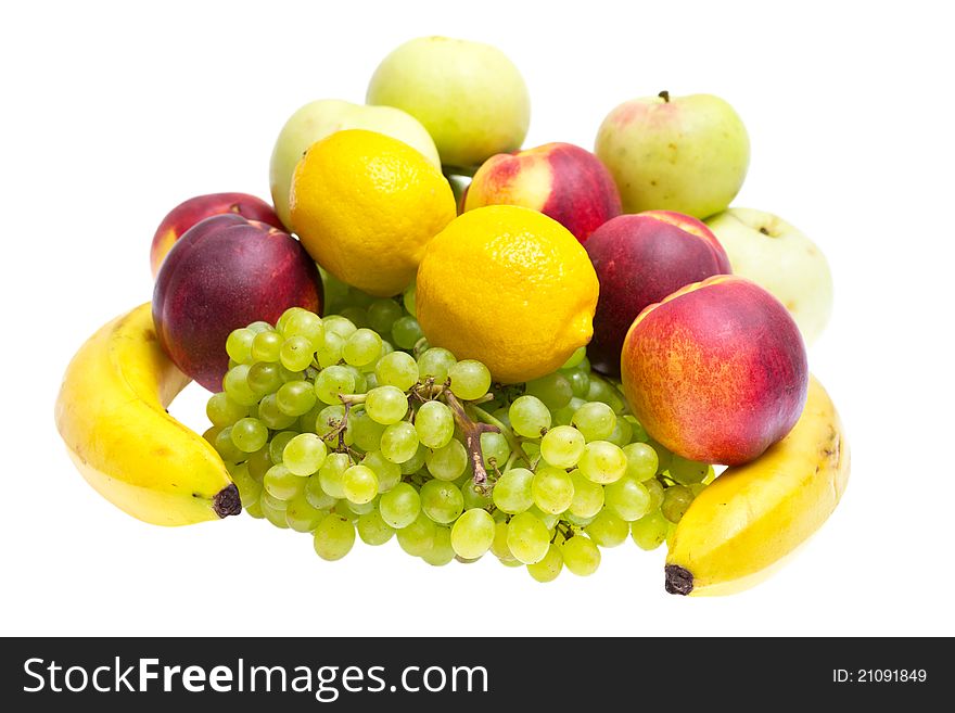 Apples, peaches, bananas, grapes on a white