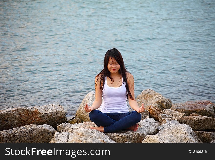 Beautiful Young Woman Doing Yoga Exercise