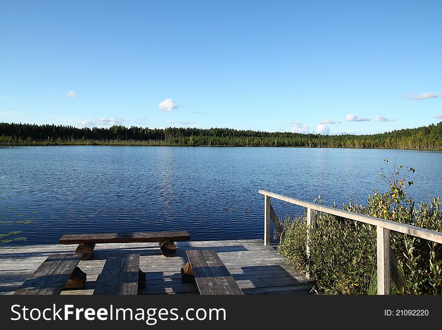 Forest lake. Summer landscape. Pier.