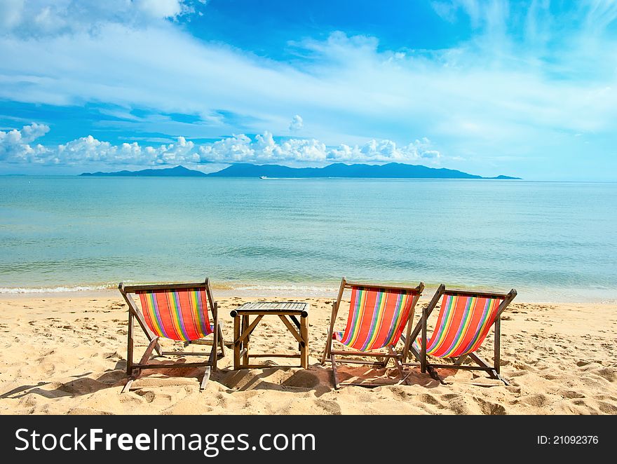 Chairs on beach near with sea