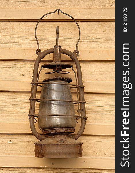 The old kerosene lamp hanging on the wall of a village house