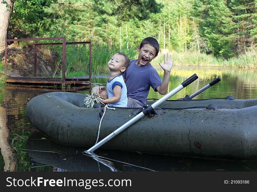 Two Little Boys Boating outdoors