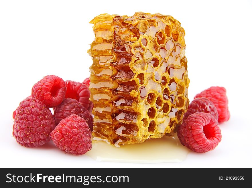 Raspberries and honeycomb close up
