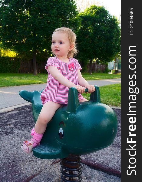 A Baby Girl On The Playground