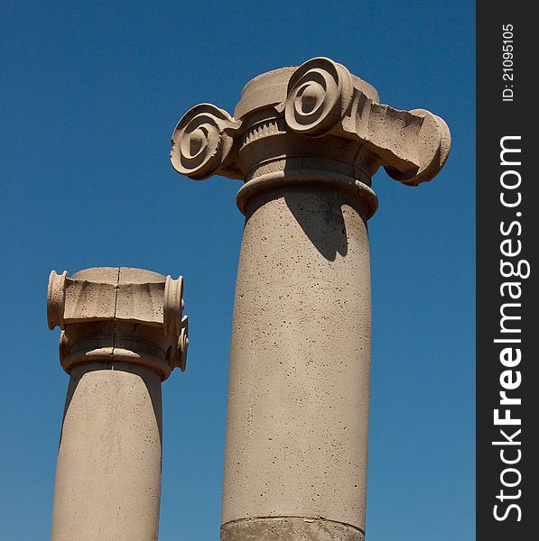 Image of 2 Greek Colums against the blue sky