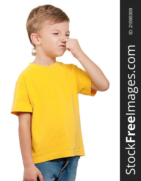 Portrait of little boy covering nose with hand on white background. Portrait of little boy covering nose with hand on white background
