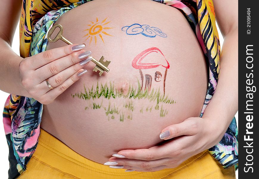 Tummy of pregnant woman with funny drawing over white background. Tummy of pregnant woman with funny drawing over white background