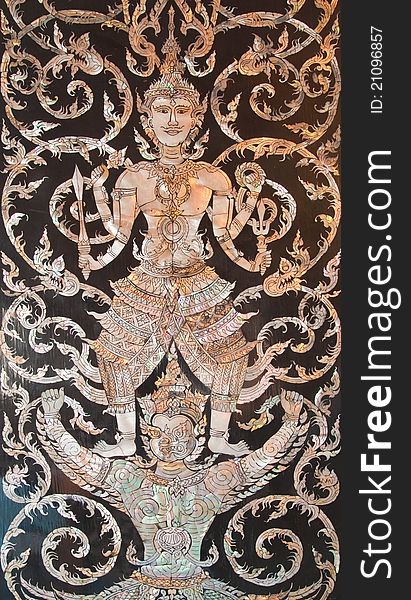 Old Thai art made from pearl on the door of Thai church,Thailand. Old Thai art made from pearl on the door of Thai church,Thailand.