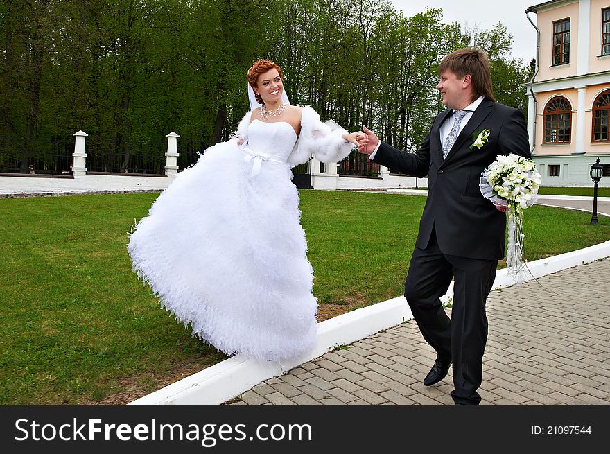 Happy Bride And Groom At Wedding Walk