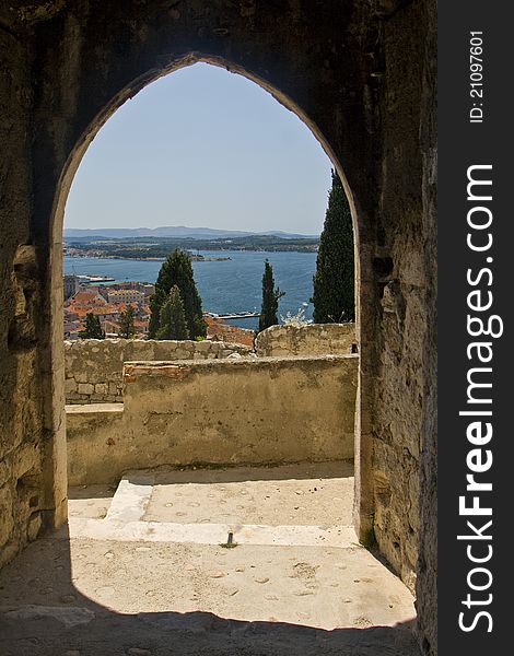 View on Sibenik and the sea through the arch gate of St.Michael. View on Sibenik and the sea through the arch gate of St.Michael