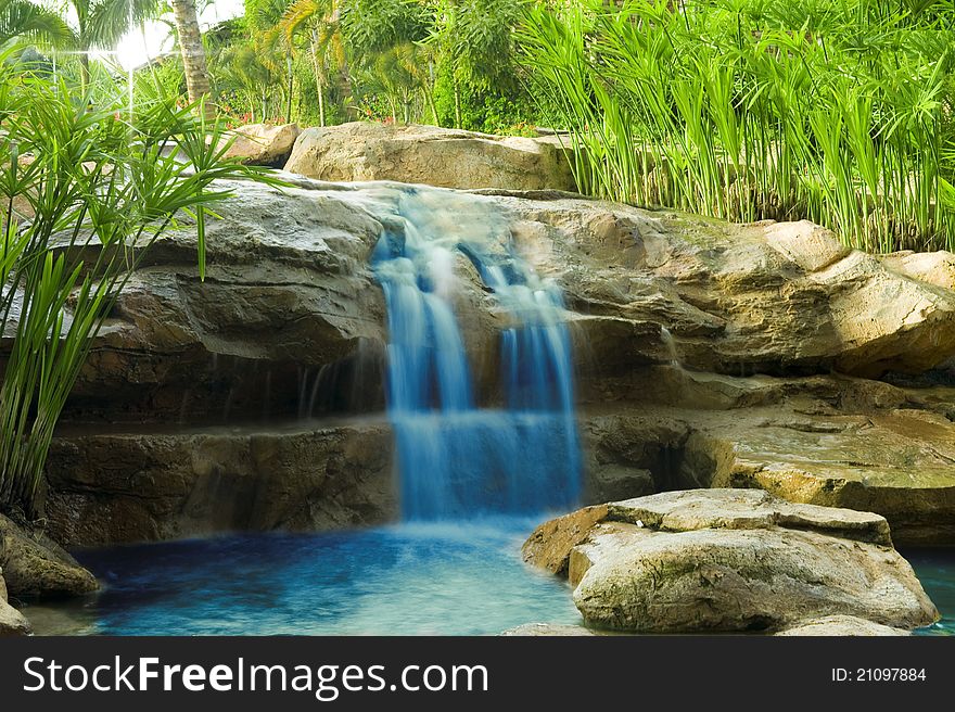 Small waterfall on a sunny summer day. Small waterfall on a sunny summer day