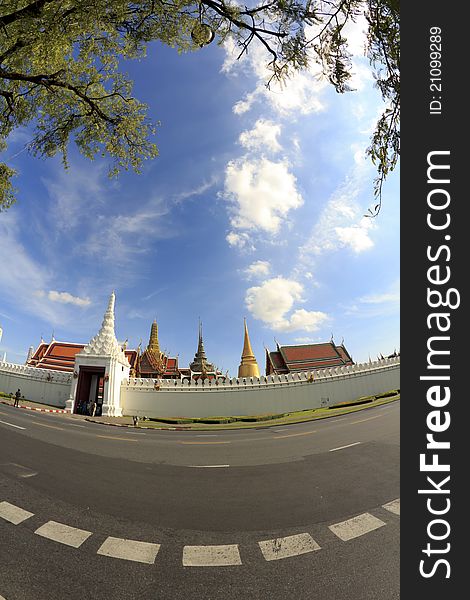 Ancient bangkok thailand grand palace and temple in bright blue sky