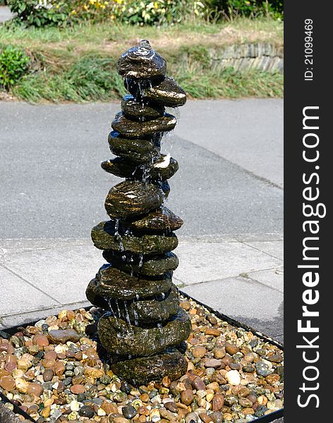 Fountain made from a pile of stones i. Fountain made from a pile of stones i