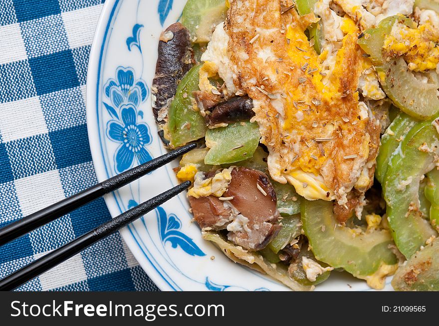 Asian style fried egg packed with nutritious vegatables and black mushrooms.