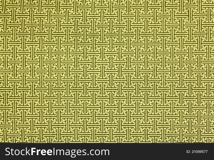 Pattern of yellow maze clothing wall paper, close up