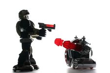 2 Toy Robots In Backlight Royalty Free Stock Photos