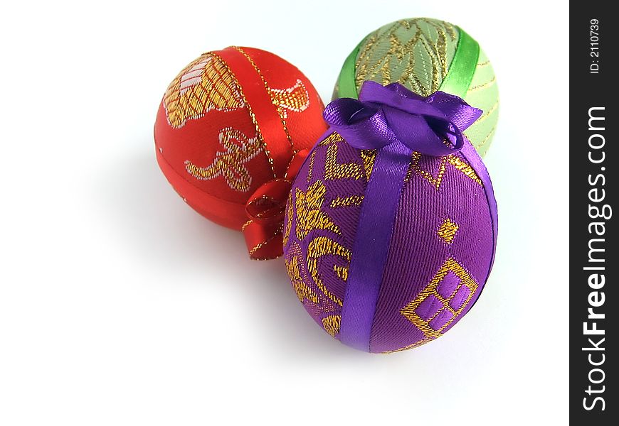 Easter painted egg tied up by tapes