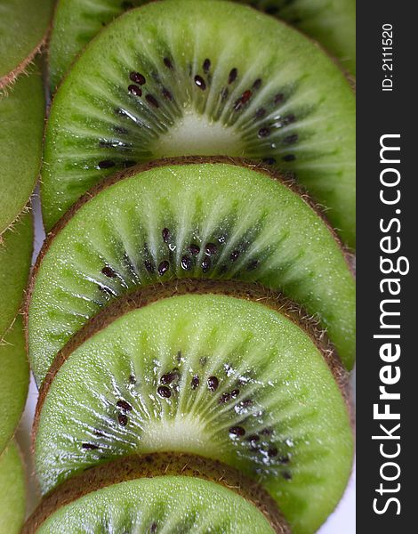 Fruits kiwi cut by slices close-up