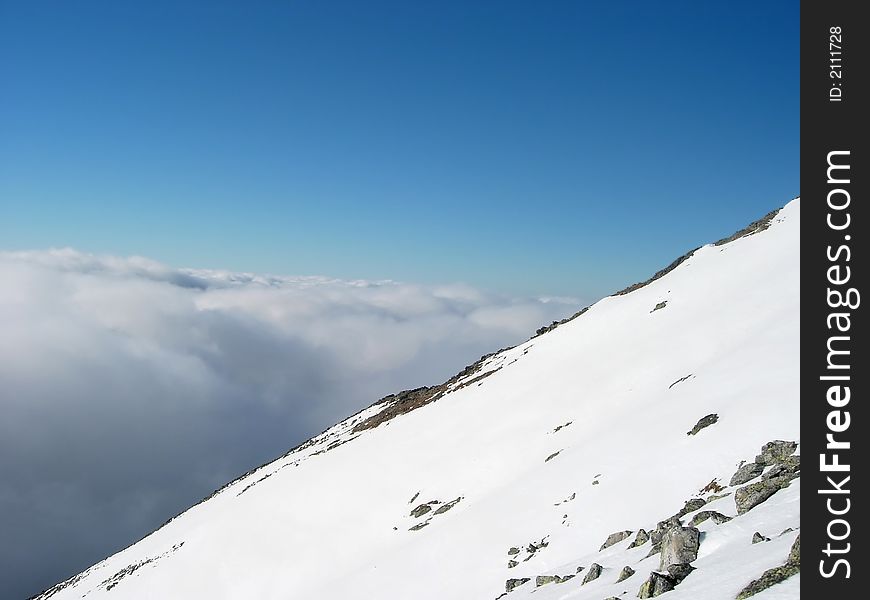 High Tatra, dramatic shot over the cloud formed by a temperature inversion. High Tatra, dramatic shot over the cloud formed by a temperature inversion