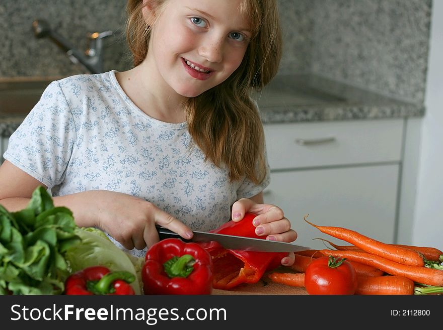 Girl learning to making the salad. Girl learning to making the salad