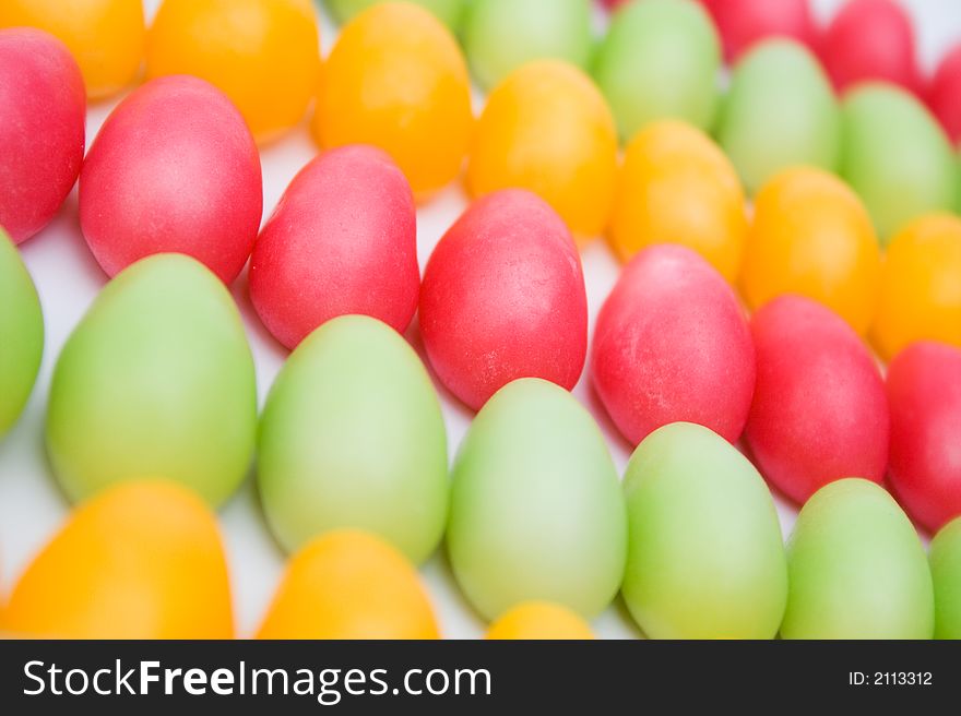 Pink, yellow and green egg shaped easter candy