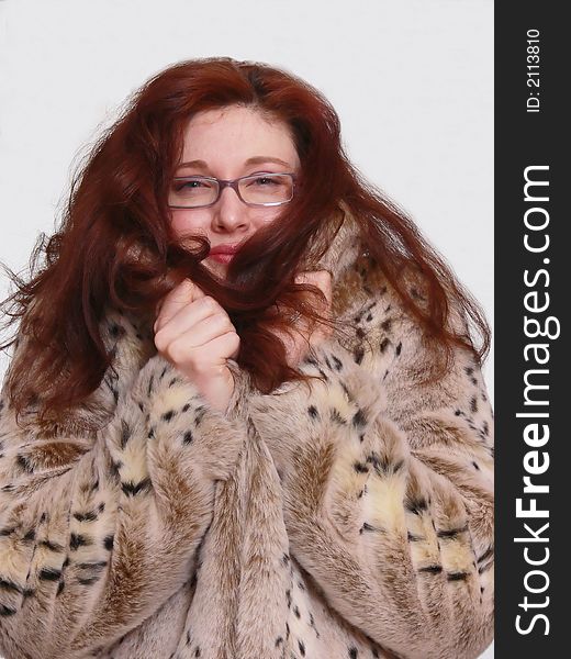 An portrait of an beautiful lady in an fur coat holding up to her face and her						
long red hair falls over her shoulder. An portrait of an beautiful lady in an fur coat holding up to her face and her						
long red hair falls over her shoulder.