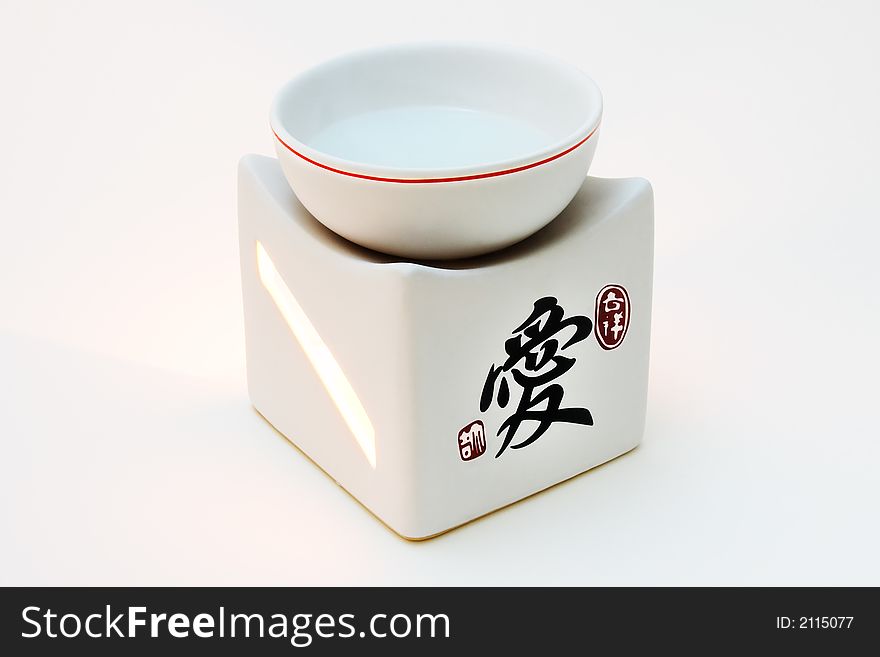 Japanese ceramic lamp for aromatherapy on a white background. Japanese ceramic lamp for aromatherapy on a white background