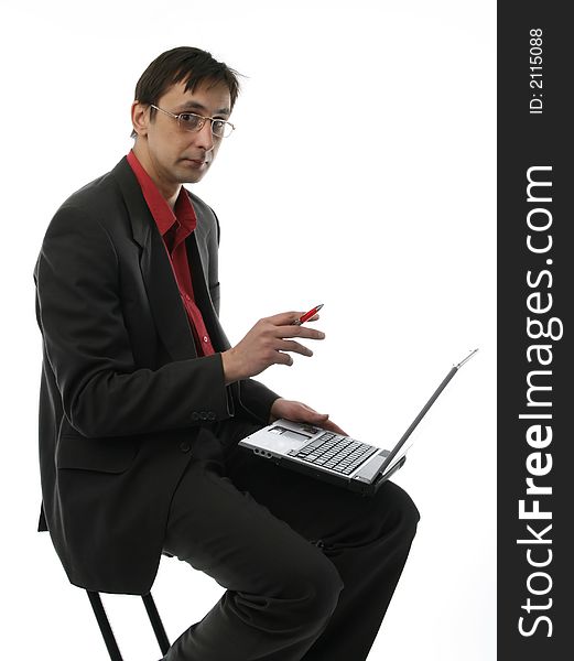 The businessman sits with laptop