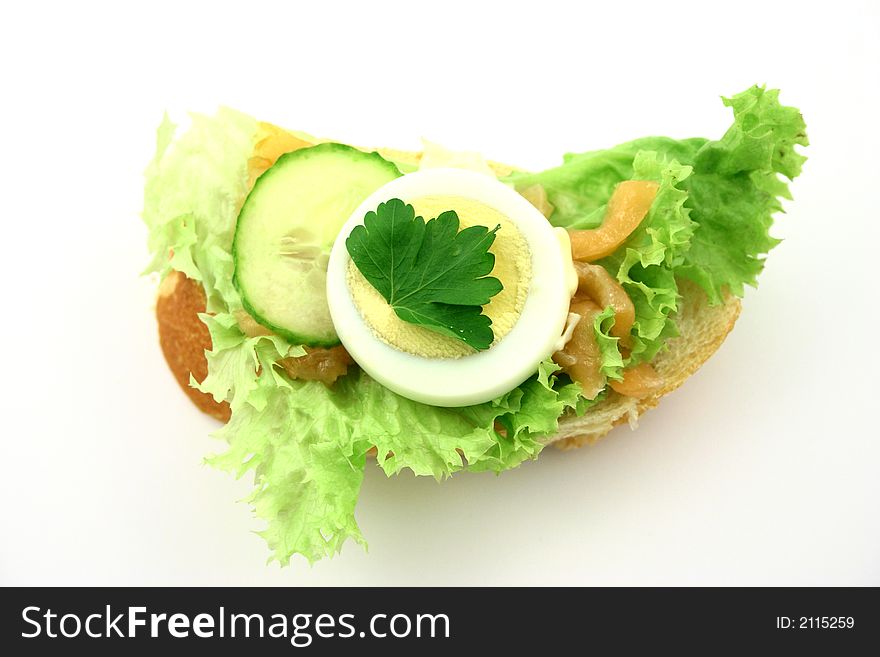 Top view at fresh sandwich with ingredients put on iceberg lettuce