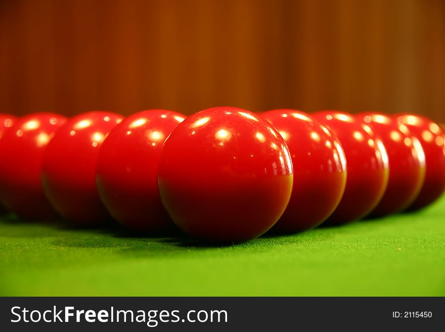 Colored billiard balls on a green billiard table. Colored billiard balls on a green billiard table