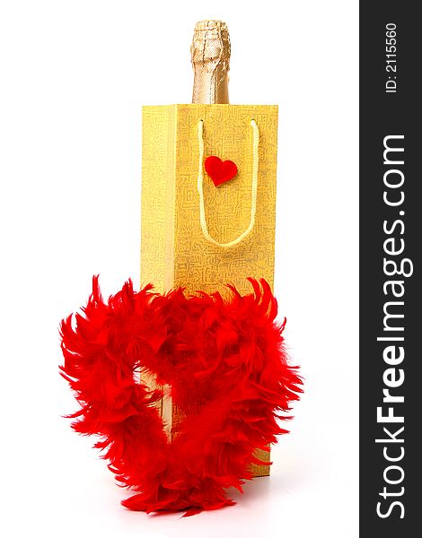 Bottle with a champagne and heart made of red feathers