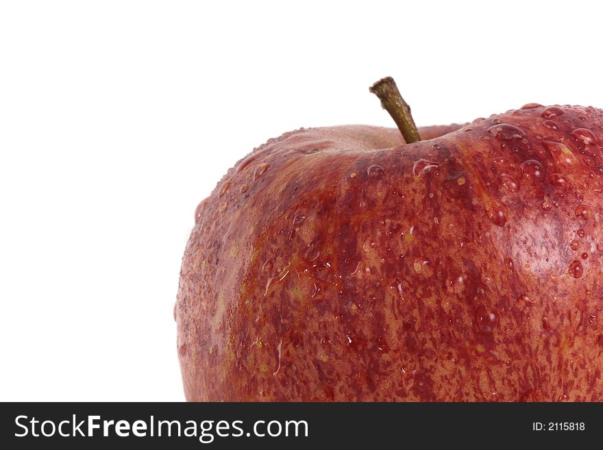 A delicious red apple with waterdrops over 100 % white background. A delicious red apple with waterdrops over 100 % white background.