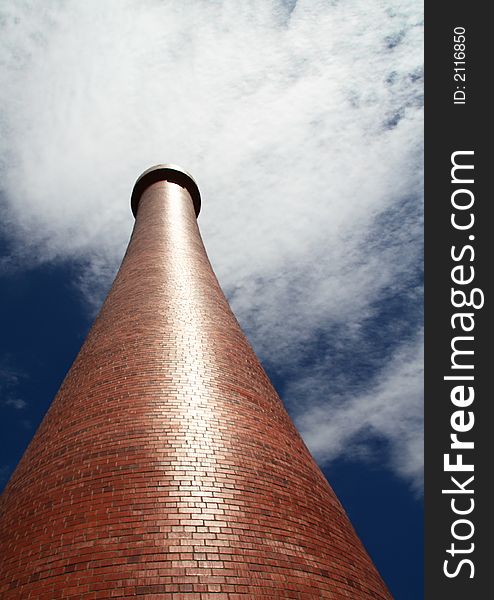 Modern red brick lighthouse, upwards perspective