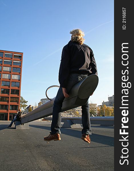 Girl on seesaw in berlin