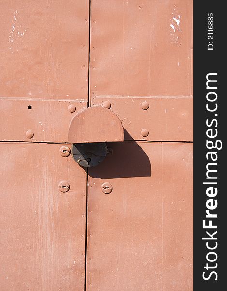 The padlock on metal gate